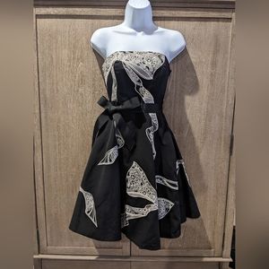 White House Black Market strapless dress with white embroidery and ribbon sash